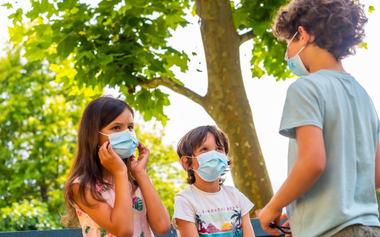 Kids outdoors wearing face mask