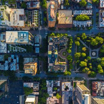 aerial view of a green buildings in a city