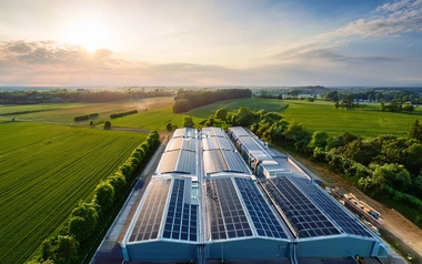 Solar panels on a data centre roof in a rural setting