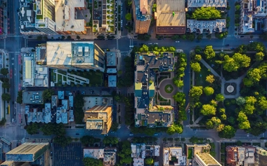 aerial view of a green city and buildings