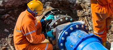 An engineer looking at  water pipelines 