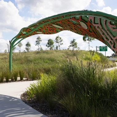 Decorative canopy structure above landscaped planting