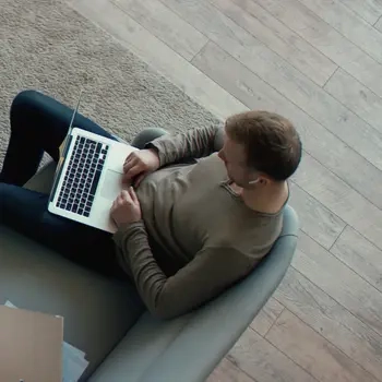 male employee working on his laptop