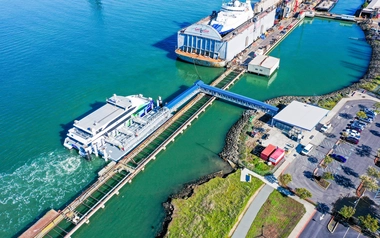 Aerial view of a dockyard with a large ship