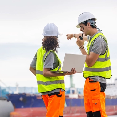 Project professionals coordinating on site at a port