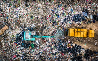 Aerial view garbage truck unload garbage to a landfill