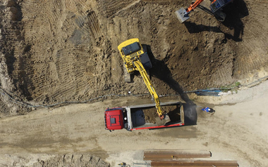 Trench dump truck and excavator in a quarry