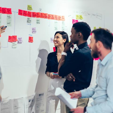 AdobeStock_364545871_students_at_whiteboard.jpeg