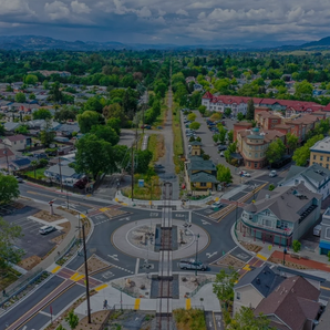 Optimizing intersection improvements with rail crossing and roundabout solutions