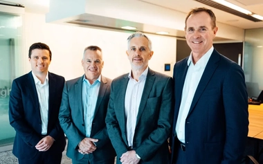 Four businessmen on suits