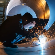 male personnel welding steel plates