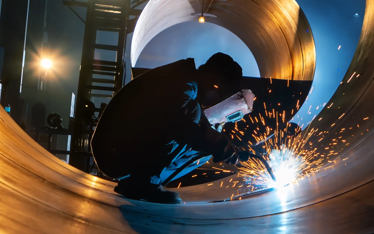 male personnel welding steel plates