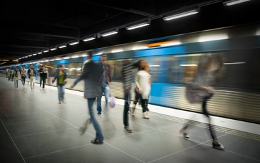 Blurred people on train platform