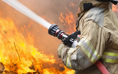 Firefighter putting out fire