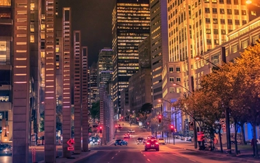 Night buildings with lights and cars at night in Montreal