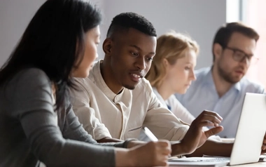 Multiethnic colleagues seated in a room