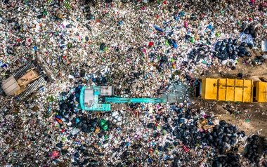 Aerial view garbage truck unload garbage to a landfill