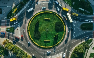 aerial view of a roundabout with cars