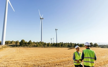 Engineers working at renewable wind energy farm