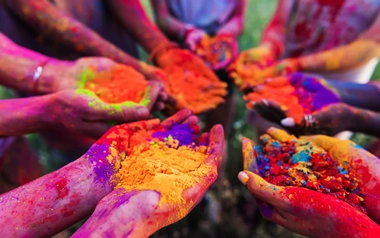 AdobeStock_164953781_hands holding colorful powder