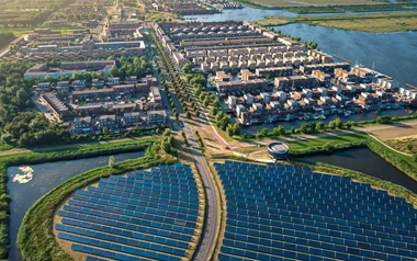A row of solar panels and buildings