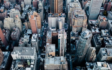 9YuAgukwe2c_unsplash_birds eye view of grey buildings