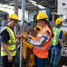 female safety engineer conducting a machine inspection