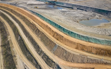 Aerial view of industrial terraces on mineral open pit mine.