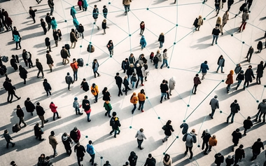 Top-down view of people connected by lines forming a network, representing social connectivity.