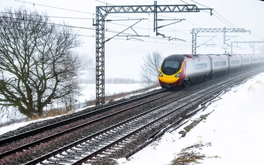 Cloudy foggy winter day view of Train on UK Railroad in England
