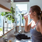 woman drinking a glass of water