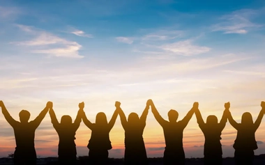 group of people holding hands