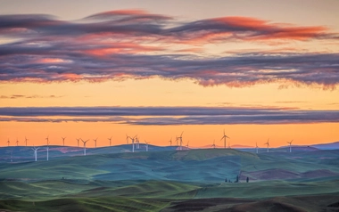 AdobeStock_860684601_Sunset-view-of-the-rolling-hills-of-the-Palouse-and-wind-turbines-seen-from-Steptoe-Butte