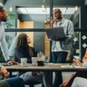 AdobeStock_504114321_Diverse people having a meeting in an office.jpeg