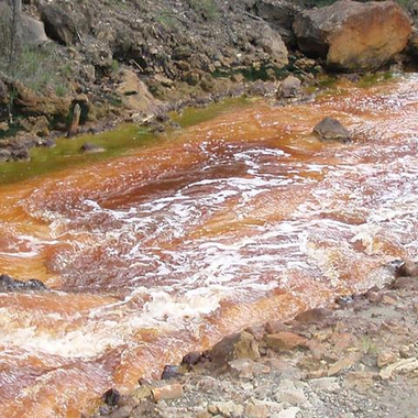 polluted river with iron ore
