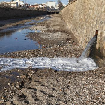 gutter water flowing to a canal