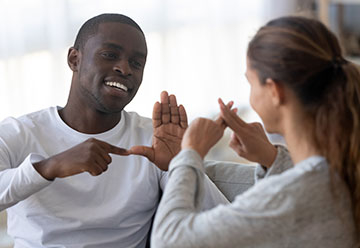 Colleagues using sign language