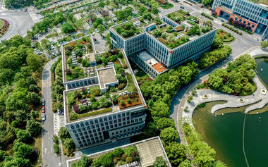 aerial view of sustainable buildings with plants in a green city