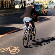 a-woman-taking-a-bike-on-a-street.jpg