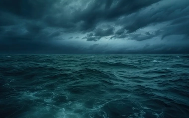 Dark blue ocean under storm clouds