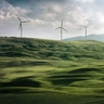 Wind turbines surrounded by grass