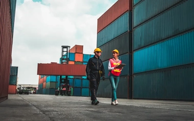 460331017_two-workers-in-shipping-container-yard