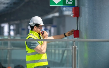 Safety engineer checking the fire alarm