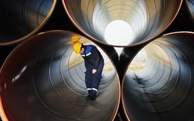 Personnel checking water pipeline