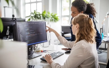 female experts analysing data on a computer