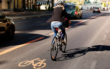 a-woman-taking-a-bike-on-a-street.jpg