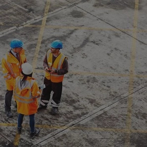 Aerial view of workers discussing with blue and white hard hats