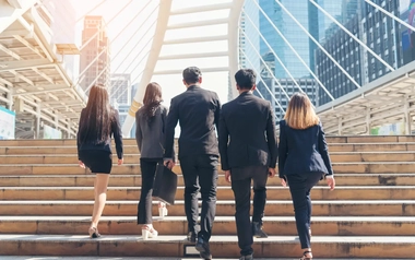 Employees walking up the stairs