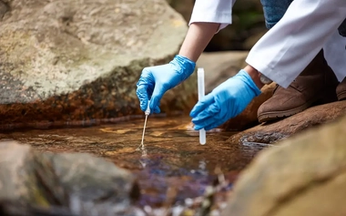 scientist taking water sample