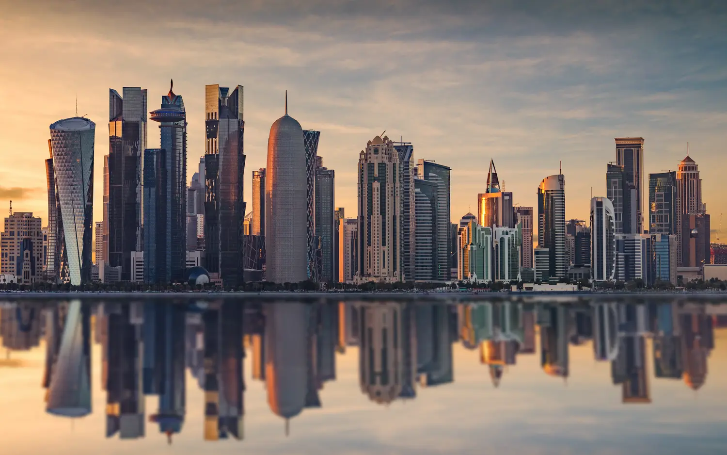 Panoramic view of Qatar Skyline with water reflection